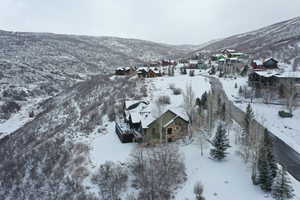 Snowy aerial view with a mountain view