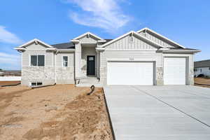 View of front facade featuring a garage