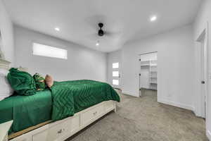 Bedroom featuring recessed lighting, light colored carpet, baseboards, and multiple windows