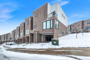 View of property with a garage