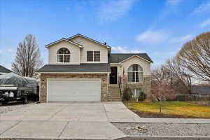 View of front of property featuring a garage