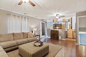 Living room with hardwood / wood-style floors