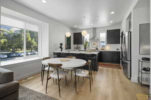 Dining room with tons of natural light from oversized bay window