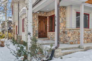 View of snow covered property entrance