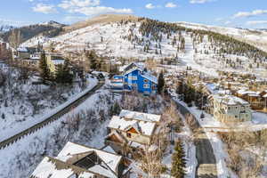 Snowy aerial view with a mountain view