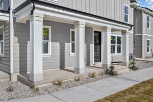 Property entrance with covered porch