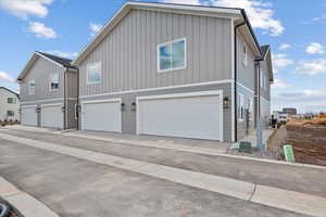 View of property exterior with a garage