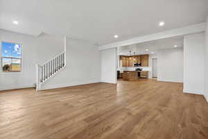 Unfurnished living room with light wood-type flooring