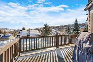 Spacious deck with a mountain view