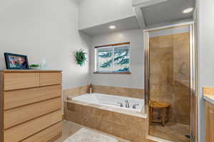 Master Bathroom with shower with separate jetted bathtub and vanity