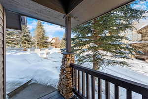 View of snow from covered porch