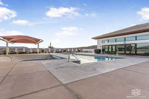 View of swimming pool with a patio area