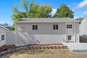 Back of property featuring a wooden deck