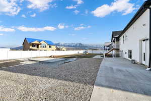 View of yard featuring a mountain view, and a patio