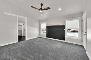 Primary Bedroom with vaulted ceiling, deck access, and plenty of light!