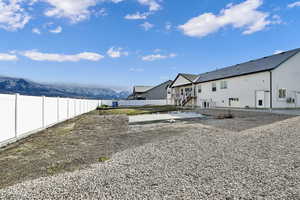 Rear view of house featuring a mountain view