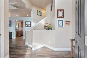 Entryway with dark wood-type flooring