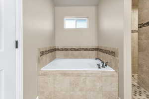 Bathroom with a relaxing tiled tub