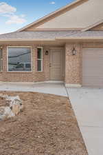 Property entrance featuring a garage