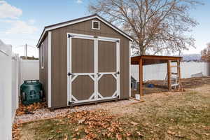 View of outbuilding with a lawn