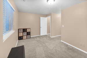 Interior space featuring a textured ceiling