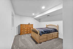 Bedroom featuring light colored carpet