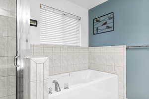 Bathroom with shower with separate bathtub