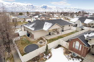 Snowy aerial view featuring a mountain view