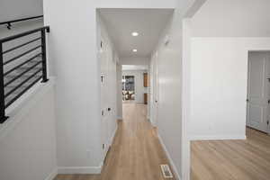 Hallway featuring light hardwood / wood-style floors