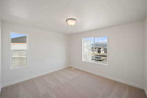 Unfurnished room with carpet floors