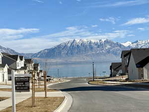 View of road featuring a water and mountain view