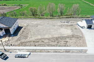 Birds eye view of property featuring a rural view