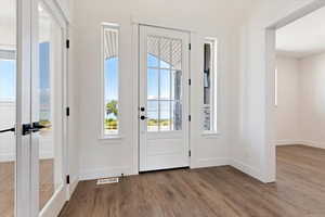 Entryway with light hardwood / wood-style floors