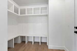 Mudroom featuring wood-type flooring