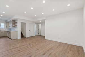 Unfurnished living room with light wood-type flooring