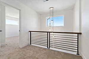 Interior space featuring light colored carpet