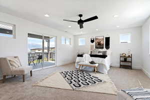 Bedroom featuring access to exterior, ceiling fan, light colored carpet, and multiple windows