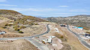 Birds eye view of property with a mountain view