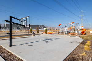 View of basketball court with a playground