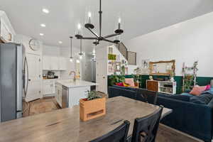 Dining room featuring an inviting chandelier and sink