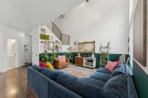 Living room with hardwood / wood-style flooring