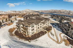 Snowy aerial view featuring a mountain view