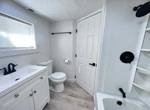 Bathroom with LVP flooring. Photo taken after renovation before owners moved in.