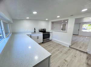 Unfurnished view of kitchen and living room. Photo taken after renovation before owners moved in.