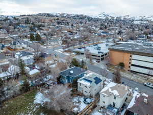 Snowy aerial view featuring a mountain view