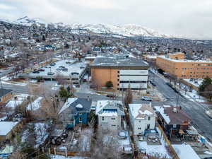 Snowy aerial view featuring a mountain view