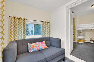 View of carpeted sitting room of bedroom