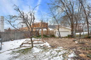 View of backyard covered in snow