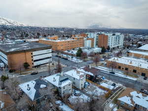 Snowy aerial view featuring a mountain view