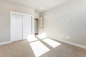 Unfurnished bedroom with a closet